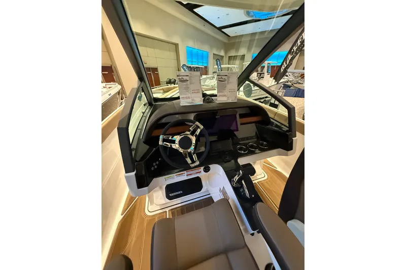 Slide: The Image of 2026 Monterey Elite 27 OB boat interior with modern dashboard and steering wheel. - 7