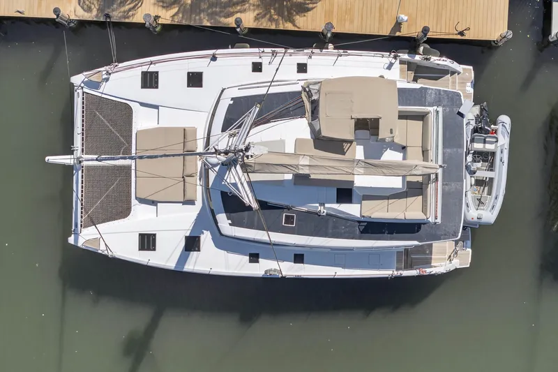 Slide: The Image of Aerial view of 2022 Fountaine Pajot Tanna 47 catamaran docked at a marina. - 10