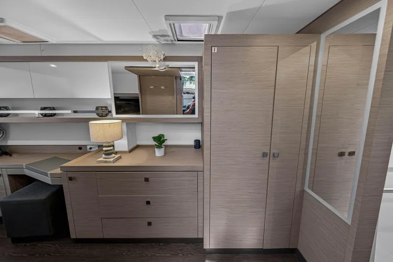Slide: The Image of 2022 Fountaine Pajot Tanna 47 interior with modern cabinetry and elegant decor. - 100