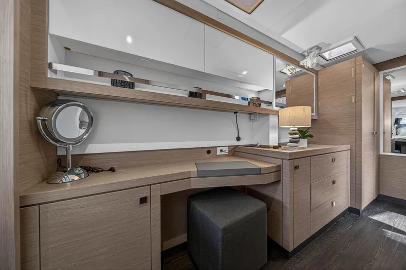 Slide: The Image of Luxurious interior of 2022 Fountaine Pajot Tanna 47 yacht with modern vanity and storage. - 105