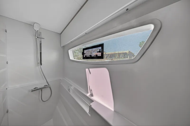Slide: The Image of Modern bathroom interior of 2022 Fountaine Pajot Tanna 47 yacht with shower and window. - 111