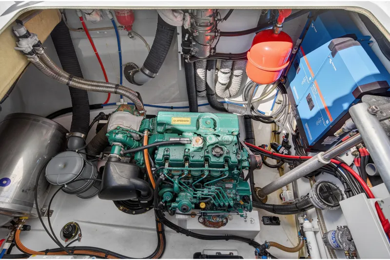 Slide: The Image of Engine room of 2022 Fountaine Pajot Tanna 47 catamaran, showcasing mechanical components and wiring. - 113