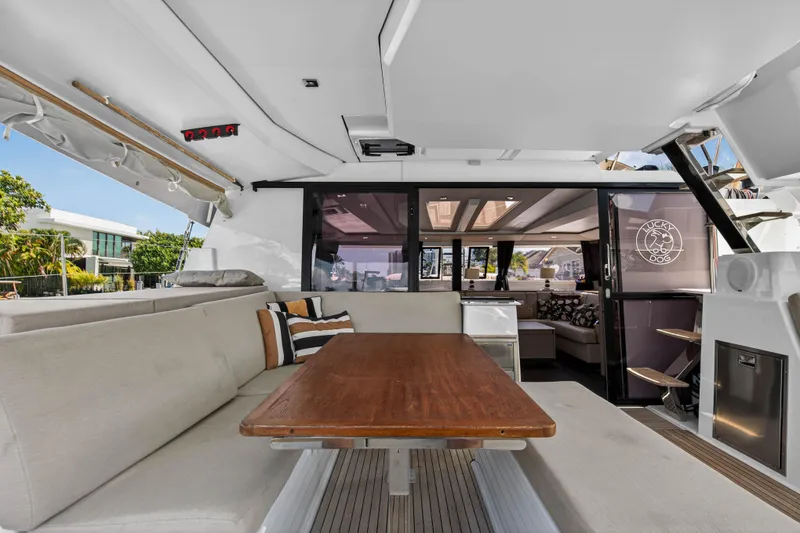 Slide: The Image of 2022 Fountaine Pajot Tanna 47 yacht interior with elegant seating and dining area. - 22