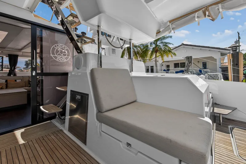 Slide: The Image of 2022 Fountaine Pajot Tanna 47 yacht with outdoor seating and modern interior design. - 27