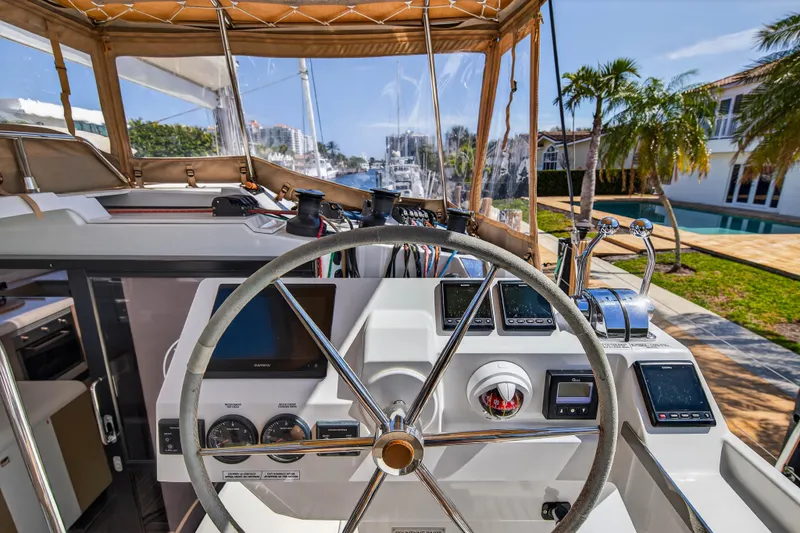 Slide: The Image of Helm of 2022 Fountaine Pajot Tanna 47 catamaran with modern navigation equipment. - 35