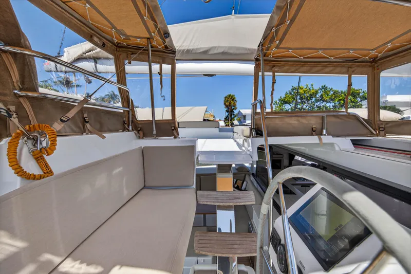 Slide: The Image of 2022 Fountaine Pajot Tanna 47 yacht cockpit with seating and navigation equipment. - 40