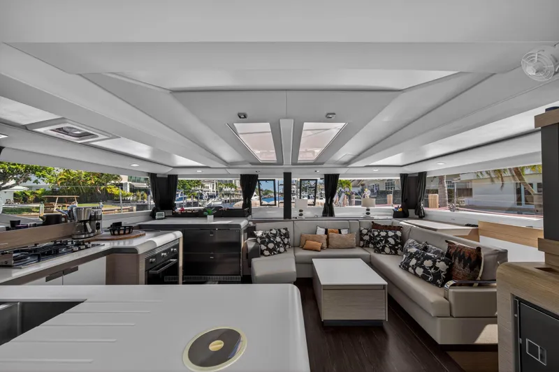 Slide: The Image of Luxurious interior of 2022 Fountaine Pajot Tanna 47 catamaran with modern kitchen and seating area. - 61
