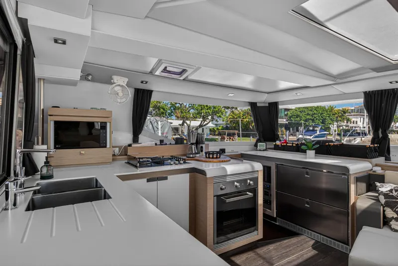Slide: The Image of Luxurious 2022 Fountaine Pajot Tanna 47 yacht interior with modern kitchen and sleek design. - 62