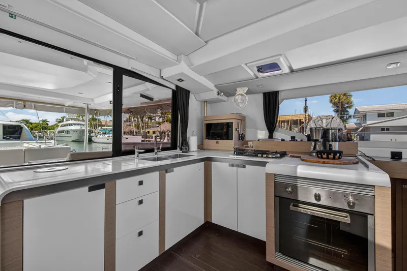 Slide: The Image of Modern kitchen interior of 2022 Fountaine Pajot Tanna 47 yacht, featuring sleek design and appliances. - 63