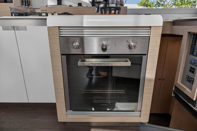 Slide: The Image of Modern kitchen oven in 2022 Fountaine Pajot Tanna 47 yacht interior. - 66