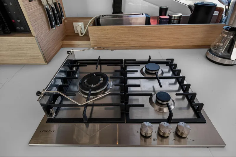 Slide: The Image of Modern kitchen stove on 2022 Fountaine Pajot Tanna 47 yacht, featuring sleek design and functionality. - 68