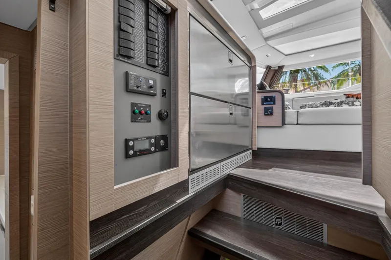 Slide: The Image of Interior of 2022 Fountaine Pajot Tanna 47 yacht, featuring modern control panel and seating area. - 70