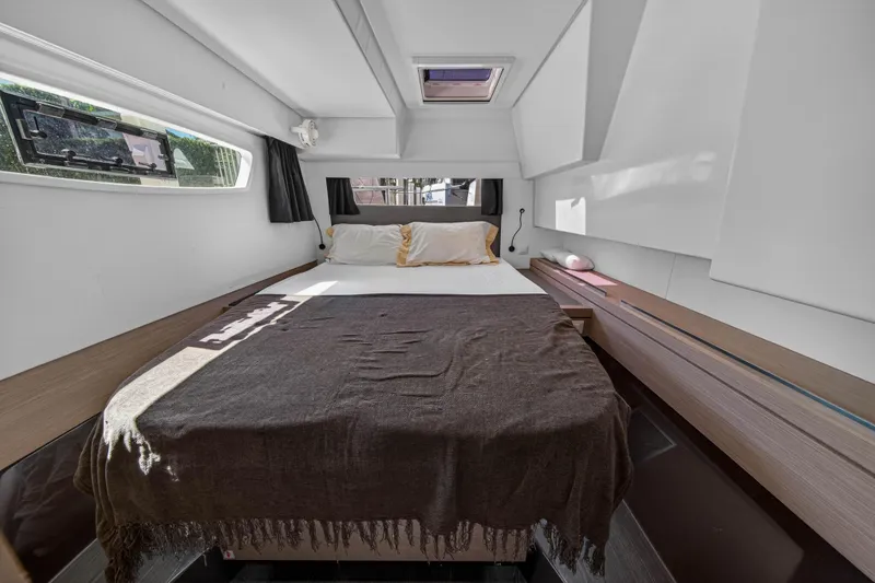 Slide: The Image of Luxurious cabin interior of 2022 Fountaine Pajot Tanna 47 yacht, featuring a cozy bed. - 82