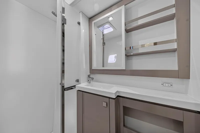 Slide: The Image of Modern bathroom interior of 2022 Fountaine Pajot Tanna 47 yacht, featuring sleek design and storage. - 85