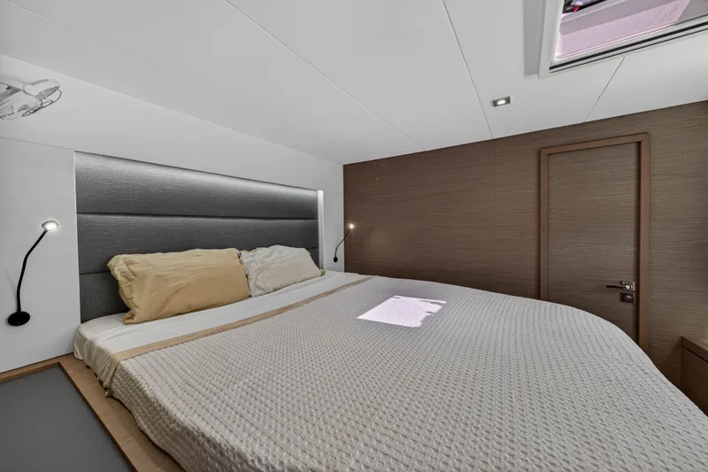 Slide: The Image of Luxurious bedroom interior of 2022 Fountaine Pajot Tanna 47 yacht, featuring modern design. - 90