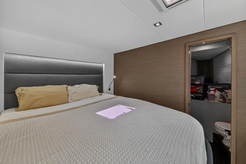 Slide: The Image of Luxurious bedroom interior of 2022 Fountaine Pajot Tanna 47 yacht with modern design. - 93