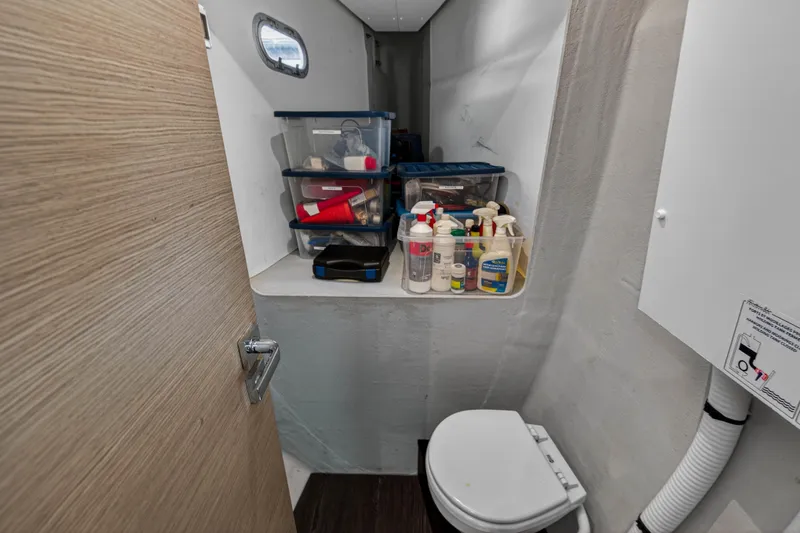 Slide: The Image of 2022 Fountaine Pajot Tanna 47 yacht bathroom with storage containers and toilet. - 94