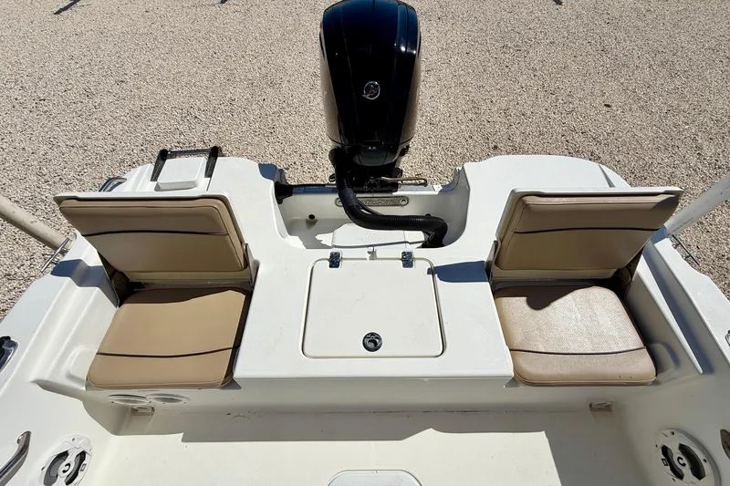 Slide: The Image of 2021 NauticStar 191 Hybrid boat with dual seats and outboard motor. - 23
