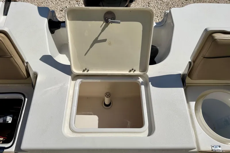 Slide: The Image of Open storage compartment on 2021 NauticStar 191 Hybrid boat deck. - 25