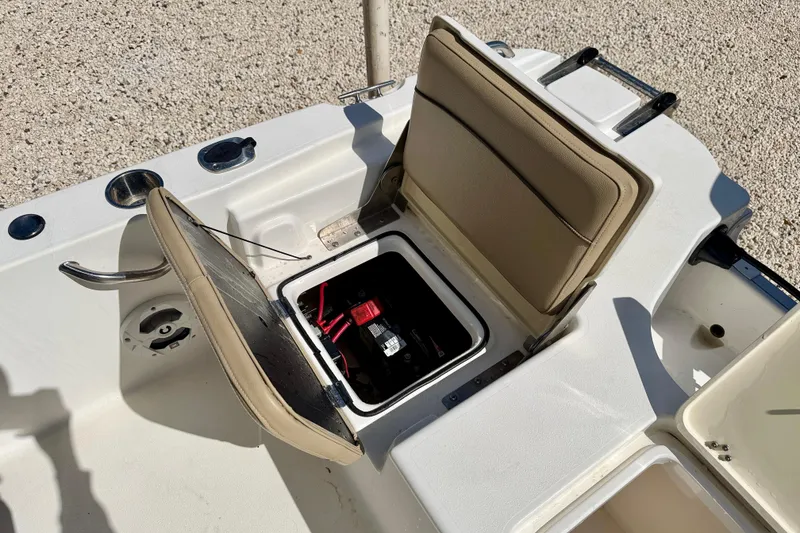 Slide: The Image of 2021 NauticStar 191 Hybrid boat with open storage compartment and seating. - 27