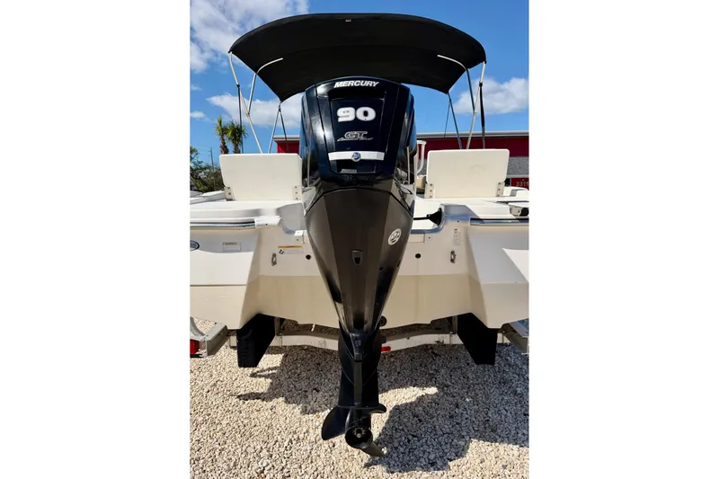 Slide: The Image of 2021 NauticStar 191 Hybrid boat with Mercury 90 HP outboard motor. - 29