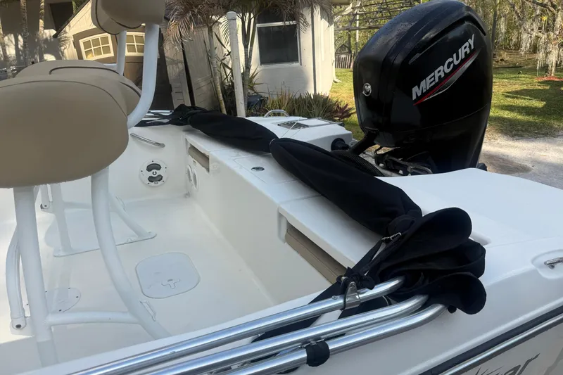 Slide: The Image of 2021 NauticStar 191 Hybrid boat on trailer under clear blue sky. - 4