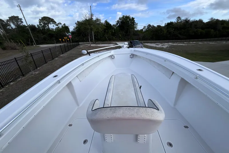 Slide: The Image of 2004 Yellowfin 36 Offshore boat with seating, parked on a driveway. - 18