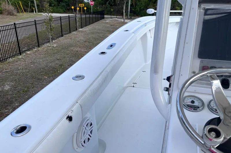 Slide: The Image of 2004 Yellowfin 36 Offshore boat interior with steering wheel and dashboard. - 27