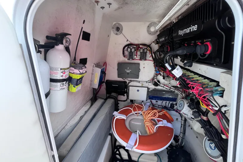 Slide: The Image of 2004 Yellowfin 36 Offshore boat interior with safety equipment and electronic wiring. - 40