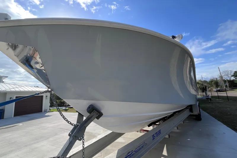 Slide: The Image of 2004 Yellowfin 36 Offshore boat on trailer under blue sky. - 42