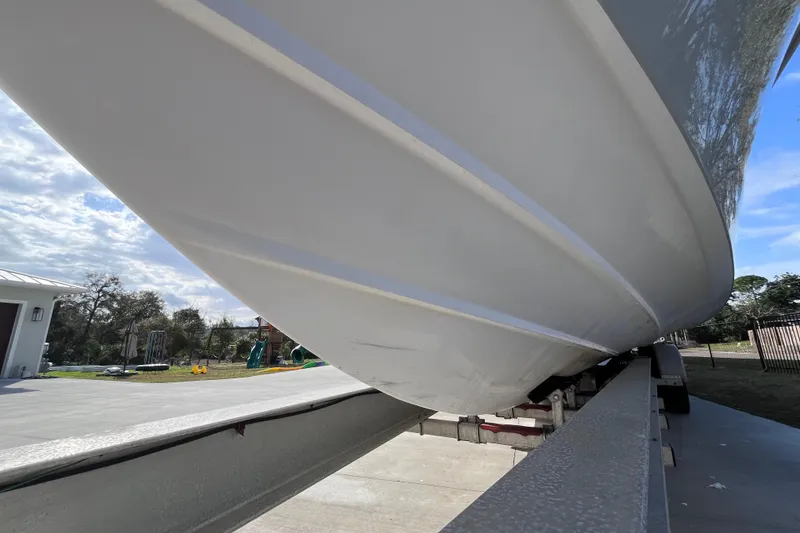 Slide: The Image of 2004 Yellowfin 36 Offshore boat hull on trailer, sunny day. - 43