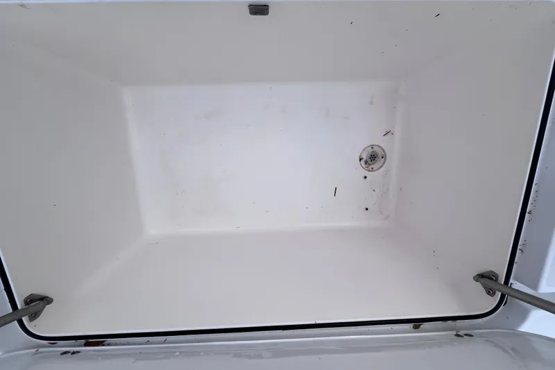 Slide: The Image of Empty storage compartment of 2004 Yellowfin 36 Offshore boat. - 60