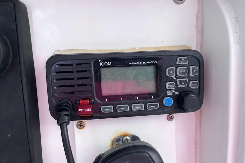 Slide: The Image of VHF marine radio on 2004 Yellowfin 36 Offshore boat dashboard. - 63