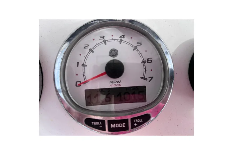 Slide: The Image of Close-up of a 2004 Yellowfin 36 Offshore RPM gauge displaying 1015 hours. - 65