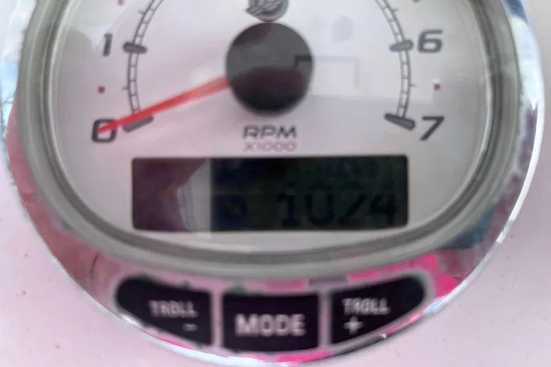 Slide: The Image of Close-up of a 2004 Yellowfin 36 Offshore RPM gauge displaying 1024 RPM. - 67
