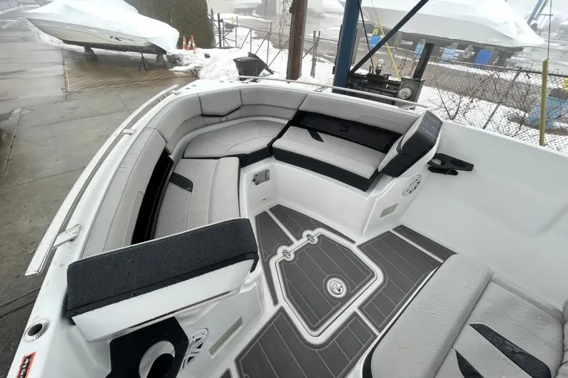 Slide: The Image of 2026 Monterey Elite 27 OB boat interior with sleek seating and modern design. - 11