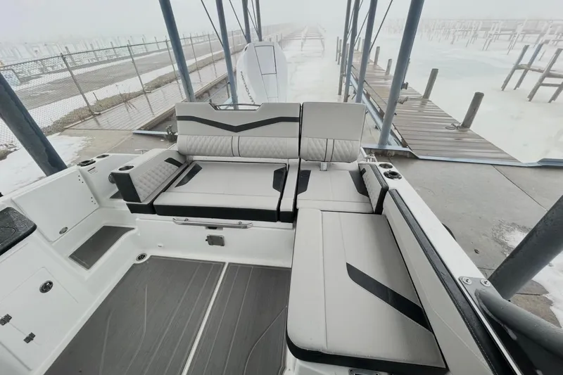 Slide: The Image of 2026 Monterey Elite 27 OB boat interior with sleek seating and modern design. - 5
