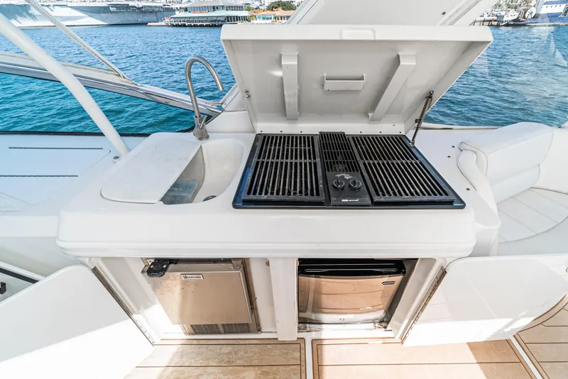 Slide: The Image of Outdoor kitchen on 2003 Carver 570 Voyager Pilothouse yacht with grill and sink. - 19