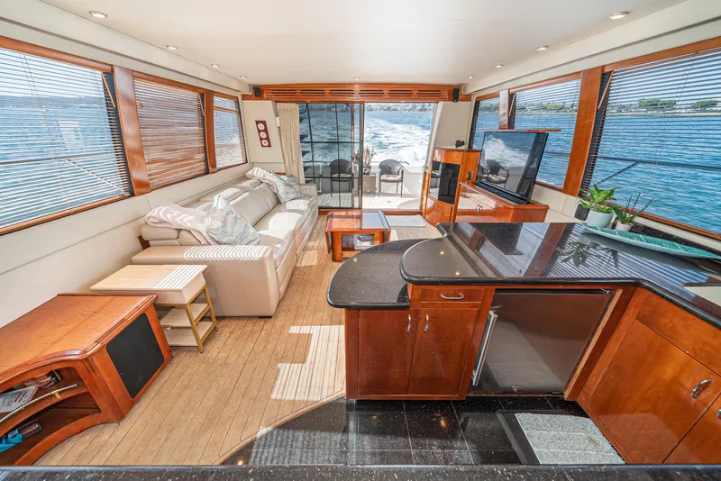 Slide: The Image of Luxurious interior of 2003 Carver 570 Voyager Pilothouse yacht with modern furnishings and ocean view. - 26