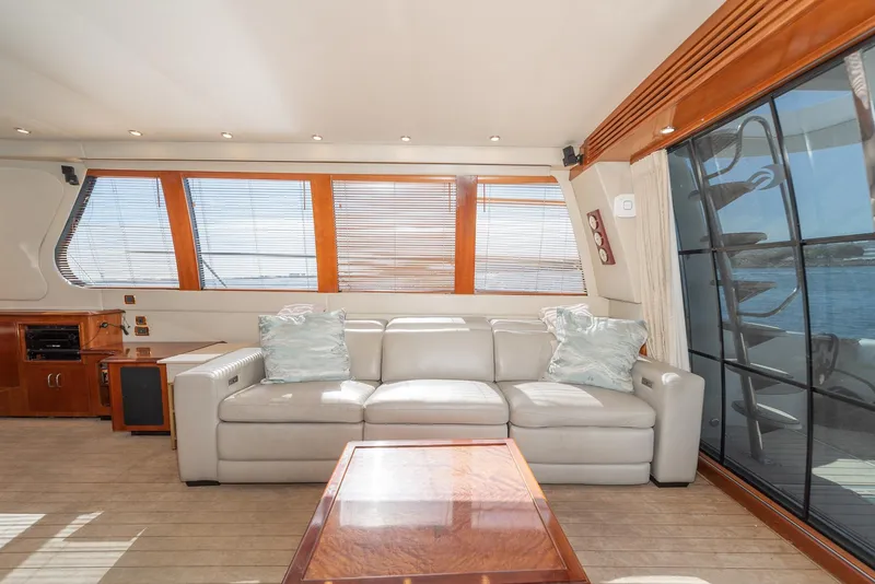 Slide: The Image of Luxurious interior of 2003 Carver 570 Voyager Pilothouse with leather sofa and panoramic windows. - 30