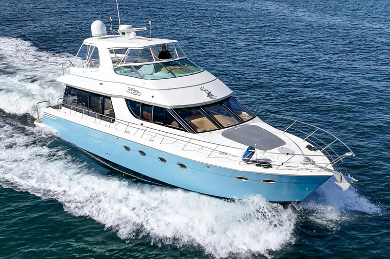 The Image of 2003 Carver 570 Voyager Pilothouse yacht cruising on open water. - 0