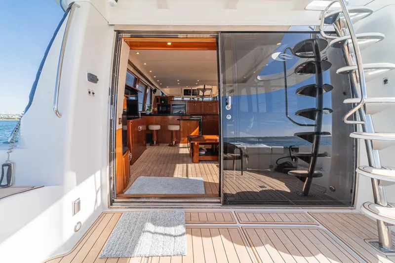 Slide: The Image of Luxurious interior of 2003 Carver 570 Voyager Pilothouse yacht with modern amenities and ocean view. - 16