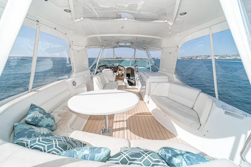 Slide: The Image of Luxurious 2003 Carver 570 Voyager Pilothouse yacht interior with elegant seating and ocean view. - 17