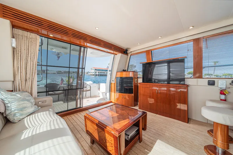 Slide: The Image of Luxurious interior of 2003 Carver 570 Voyager Pilothouse yacht with elegant wood finishes. - 35