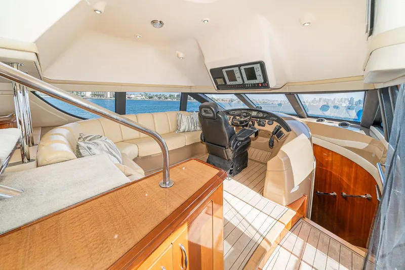 Slide: The Image of Luxurious interior of 2003 Carver 570 Voyager Pilothouse yacht with leather seating and modern helm. - 45