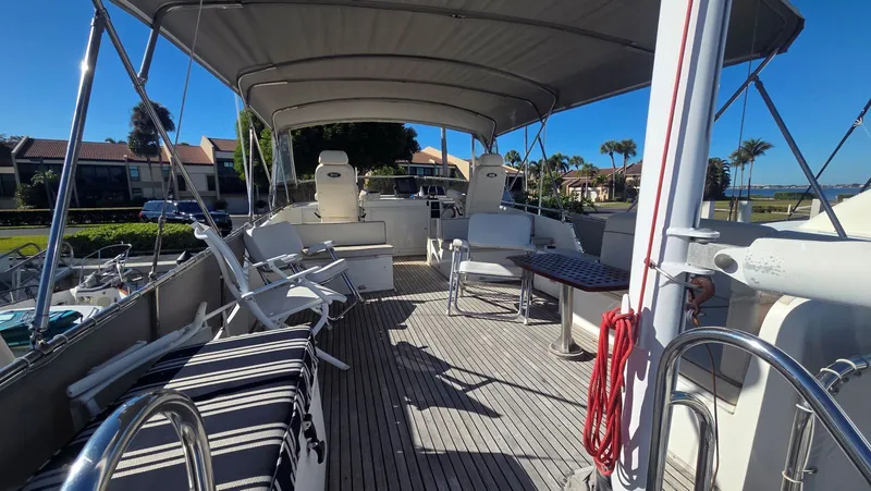 Slide: The Image of Deck of a 1997 Grand Banks 49 Classic yacht with seating area. - 17