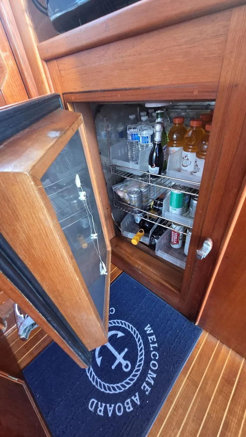 Slide: The Image of Fridge on Grand Banks 49 Classic yacht, stocked with drinks. - 26