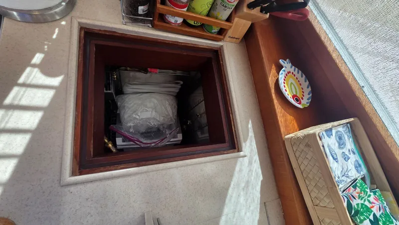 Slide: The Image of Interior of a 1997 Grand Banks 49 Classic with storage compartment. - 28