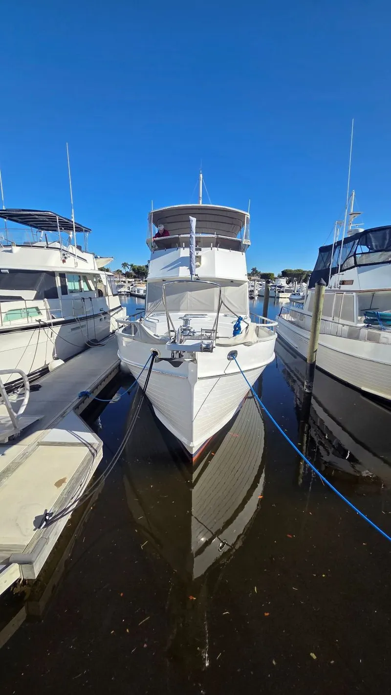 Slide: The Image of 1997 Grand Banks 49 Classic yacht docked under clear blue sky. - 6