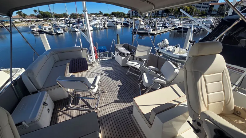 Slide: The Image of Deck of a 1997 Grand Banks 49 Classic with marina view. - 9